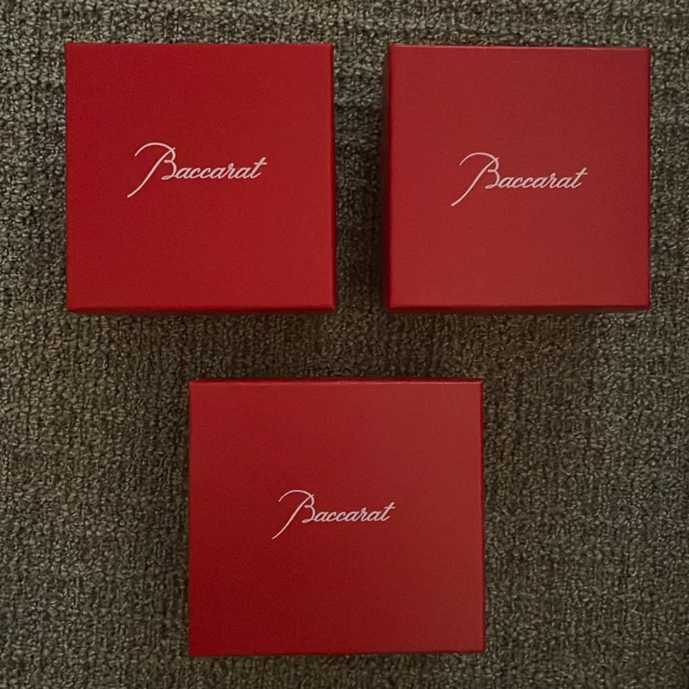 3 red Baccarat boxes